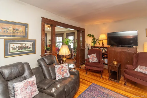 a living room with furniture fireplace and a table