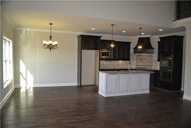 2079 Autumn Ridge Way Spring Hill, TN 37174 - Photo 6 of 19 Kitchen and eat-in; Granite Tops; Cooktop; Pot filler; tile backsplash; hood...