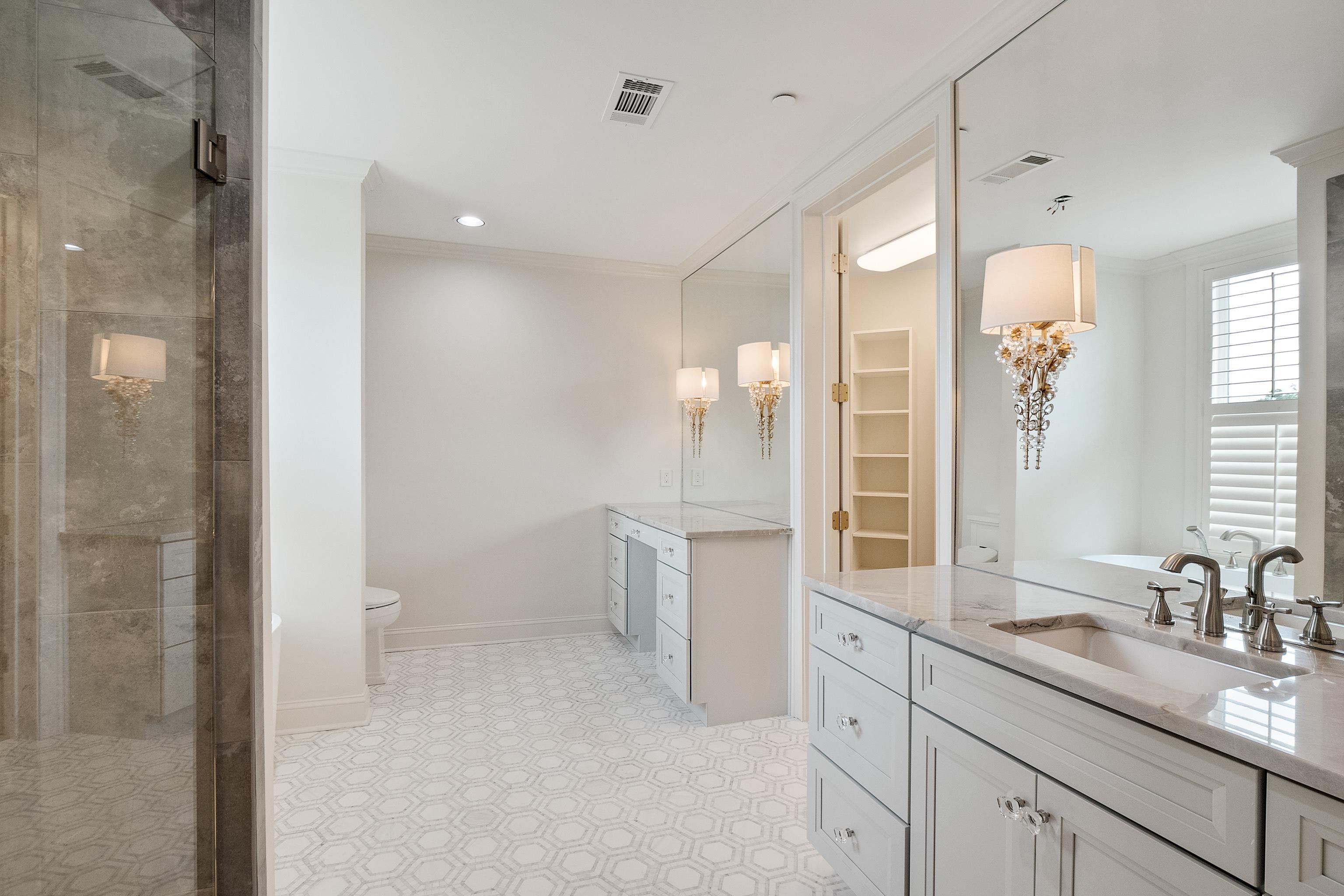 591 Lexington Road, Unit 304R Memphis, TN 38117 - Photo 26 of 35 So much new here! Highly detailed marble floor. Freestanding tub. Marble and mirrors and wall sconces!