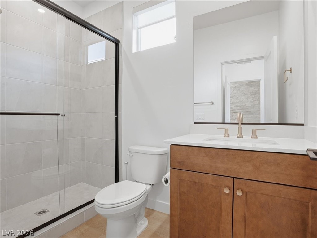 9725 Starlight Ridge Avenue Las Vegas, NV 89148 - Photo 24 of 47 This bathroom features a contemporary design with a sleek vanity and a spacious shower.