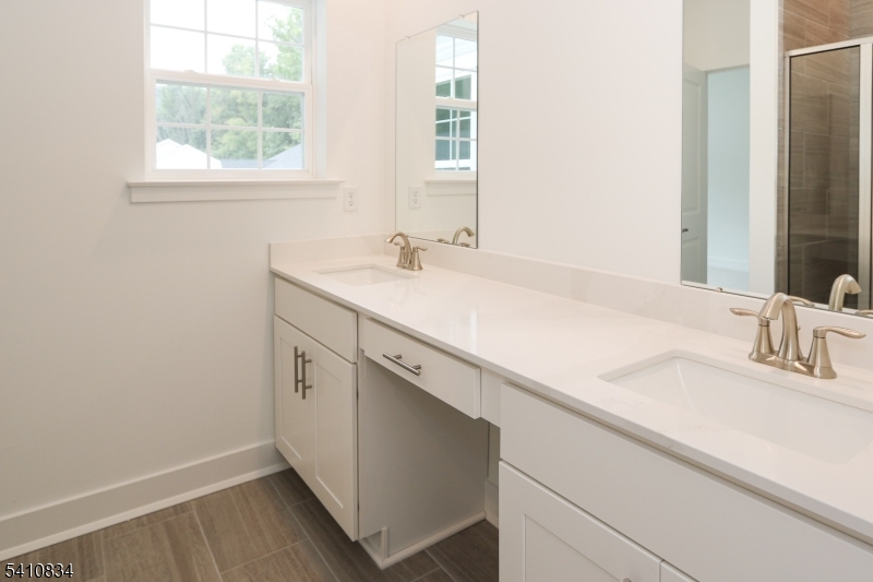 71 Veterans Way Morris Plains, NJ 07950 - Photo 12 of 23 a bathroom with a sink and a window