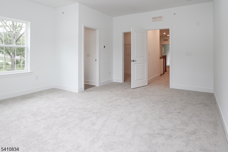 71 Veterans Way Morris Plains, NJ 07950 - Photo 14 of 23 an empty room with windows and closet