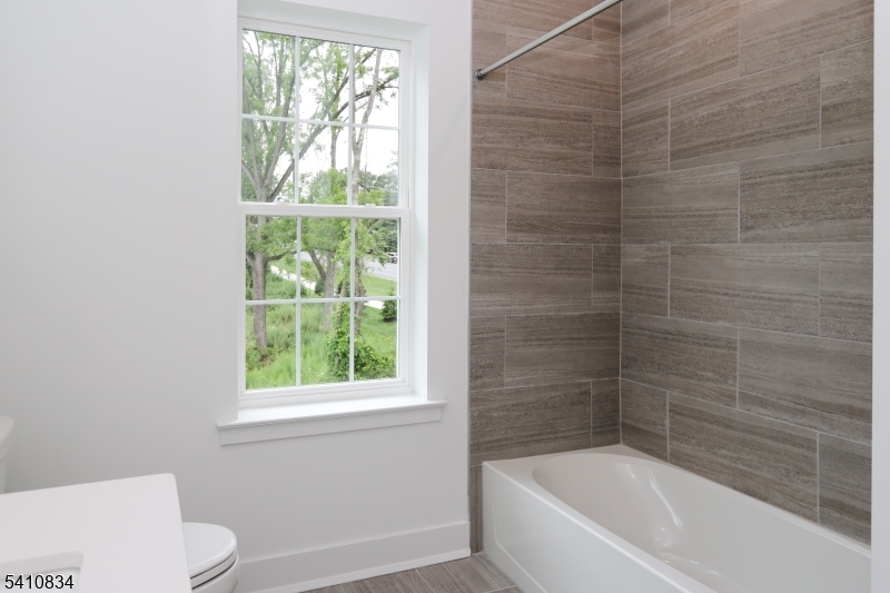 71 Veterans Way Morris Plains, NJ 07950 - Photo 21 of 23 a bathroom with a bathtub and window
