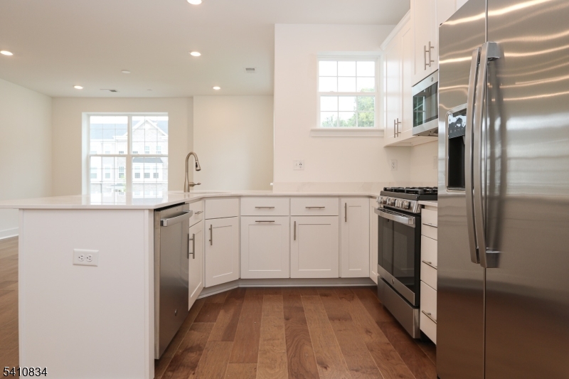 71 Veterans Way Morris Plains, NJ 07950 - Photo 5 of 23 a kitchen with a refrigerator and a sink