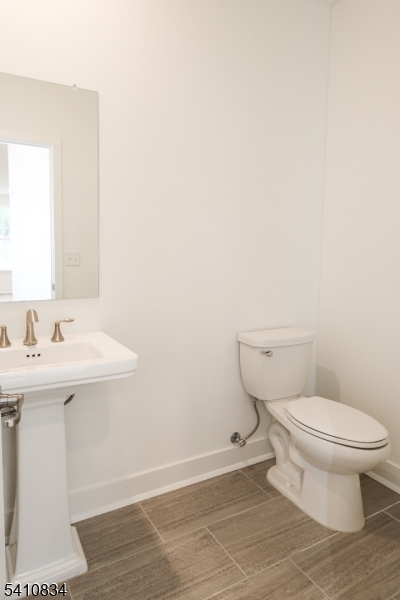 71 Veterans Way Morris Plains, NJ 07950 - Photo 8 of 23 a bathroom with a sink and a toilet