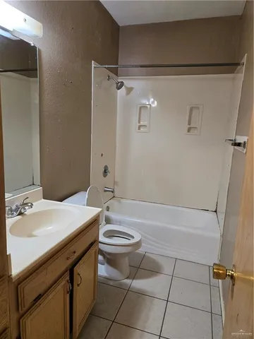 a bathroom with a sink a toilet and a bathtub