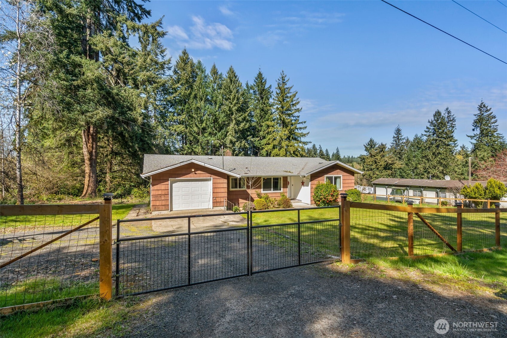 810 King Road Winlock, WA 98596 - Photo 2 of 27 a view of a house with a yard and sitting area