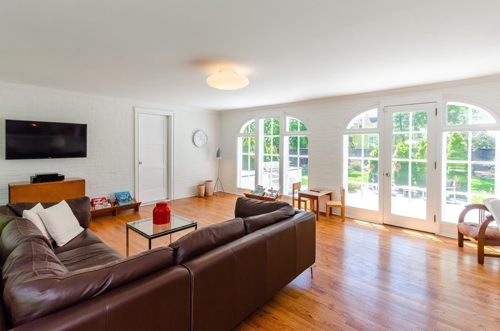 2 Old Colony Road Weston, MA 02493 - Photo 11 of 25 a living room with furniture and a flat screen tv