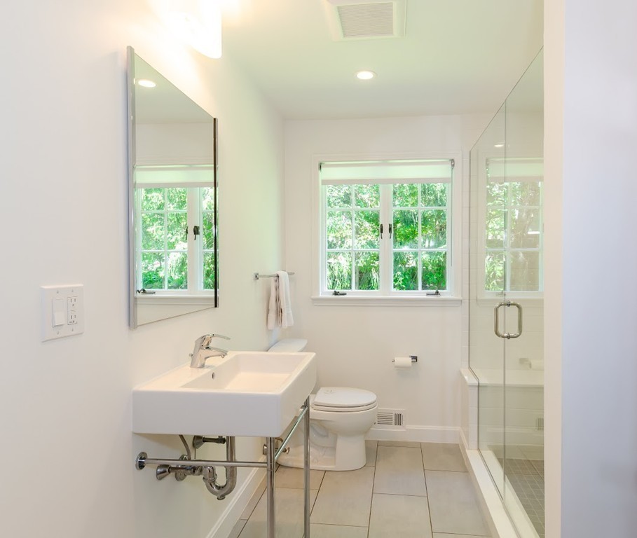2 Old Colony Road Weston, MA 02493 - Photo 15 of 25 a bathroom with a sink a toilet and a window