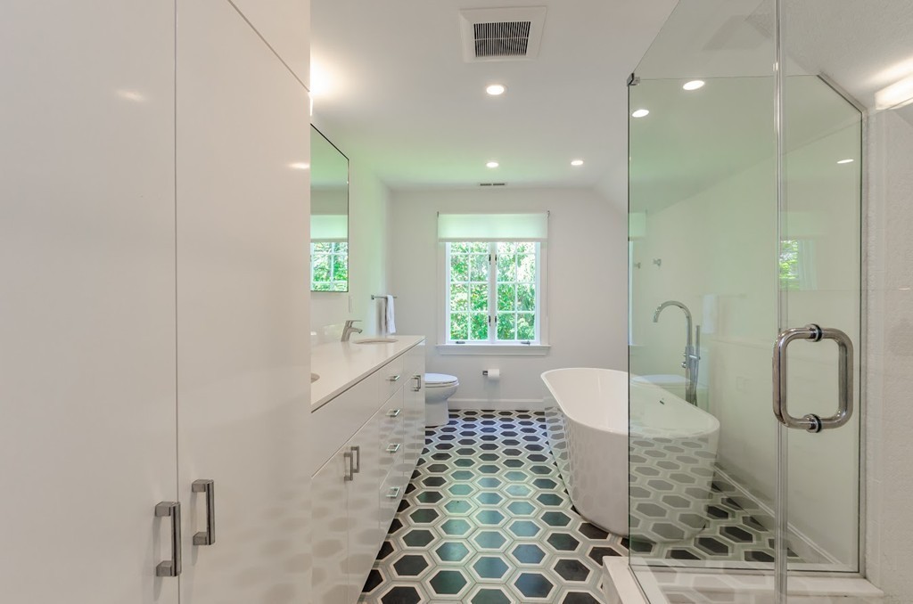 2 Old Colony Road Weston, MA 02493 - Photo 17 of 25 a bathroom with a glass door shower