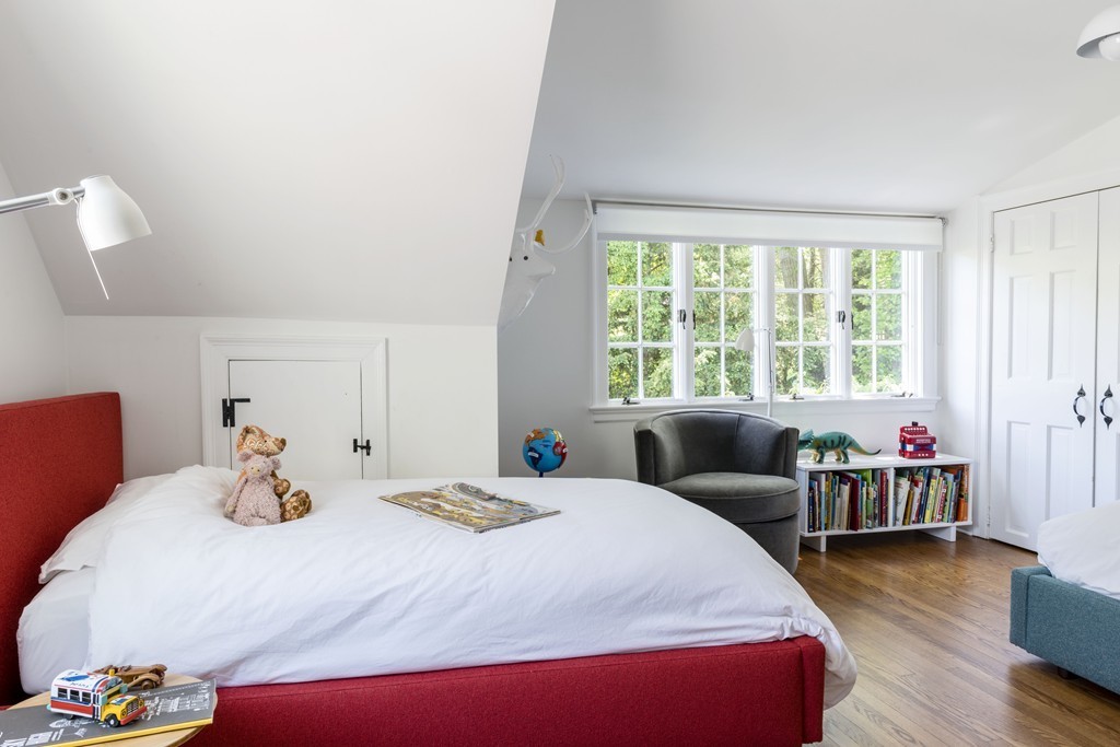 2 Old Colony Road Weston, MA 02493 - Photo 20 of 25 a bedroom with a bed and wooden floor