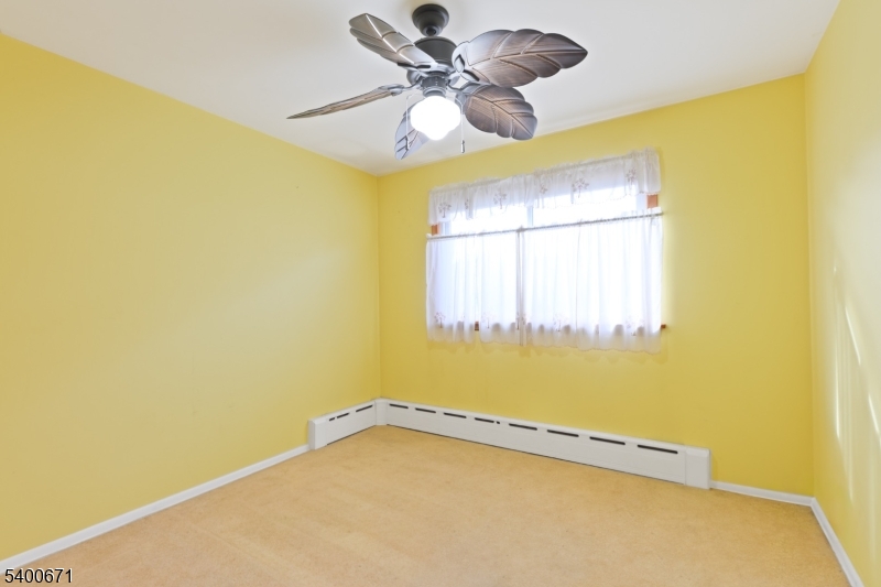 1720 Dewitt Terrace Linden, NJ 07036 - Photo 11 of 29 a view of a room with window and ceiling fan