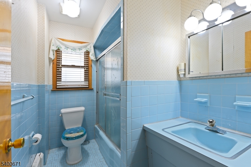 1720 Dewitt Terrace Linden, NJ 07036 - Photo 15 of 29 a bathroom with a sink a toilet and mirror