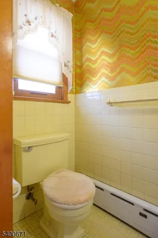 a bathroom with a toilet and a sink