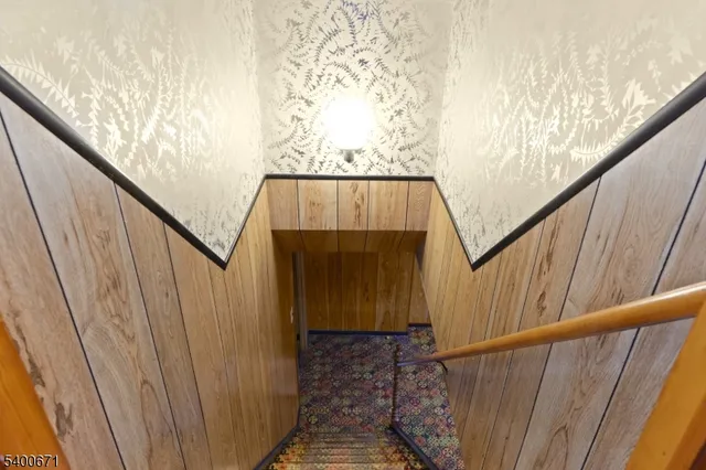 a view of stairs with wooden floor