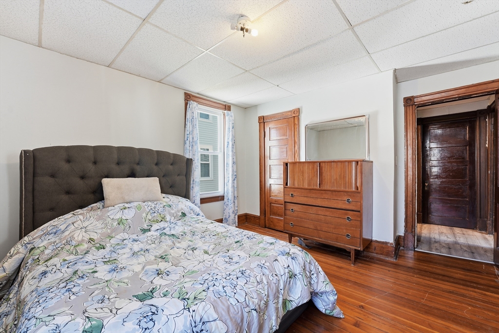 104-106 Madison Street Chicopee, MA 01020 - Photo 2 of 42 a bedroom with a bed and a dresser
