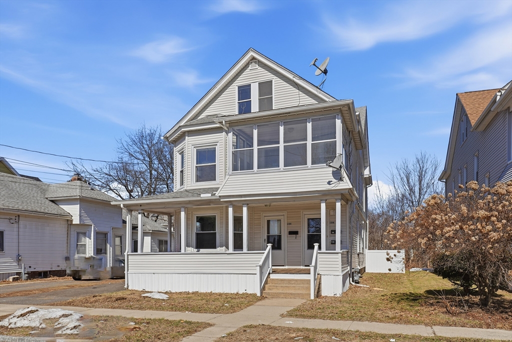 104-106 Madison Street Chicopee, MA 01020 - Photo 32 of 42 a front view of a house with a yard