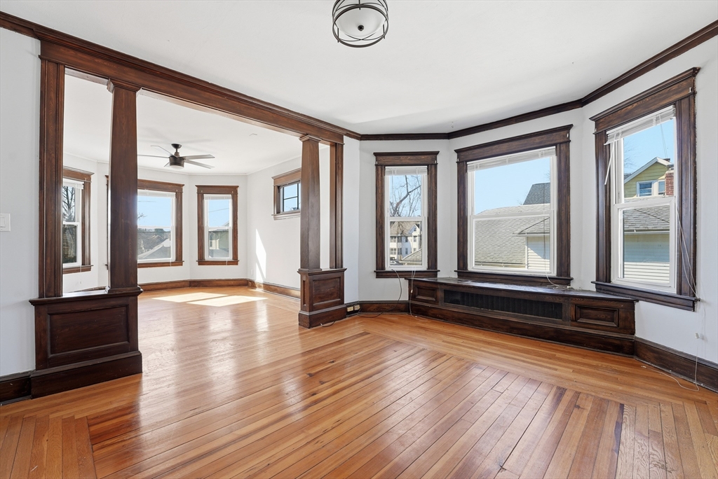 104-106 Madison Street Chicopee, MA 01020 - Photo 41 of 42 a view of empty room with wooden floor and fan