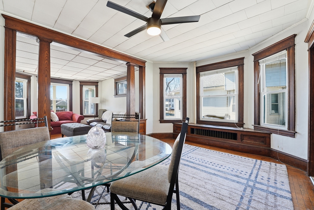 104-106 Madison Street Chicopee, MA 01020 - Photo 7 of 42 a view of a dining room with furniture window and wooden floor