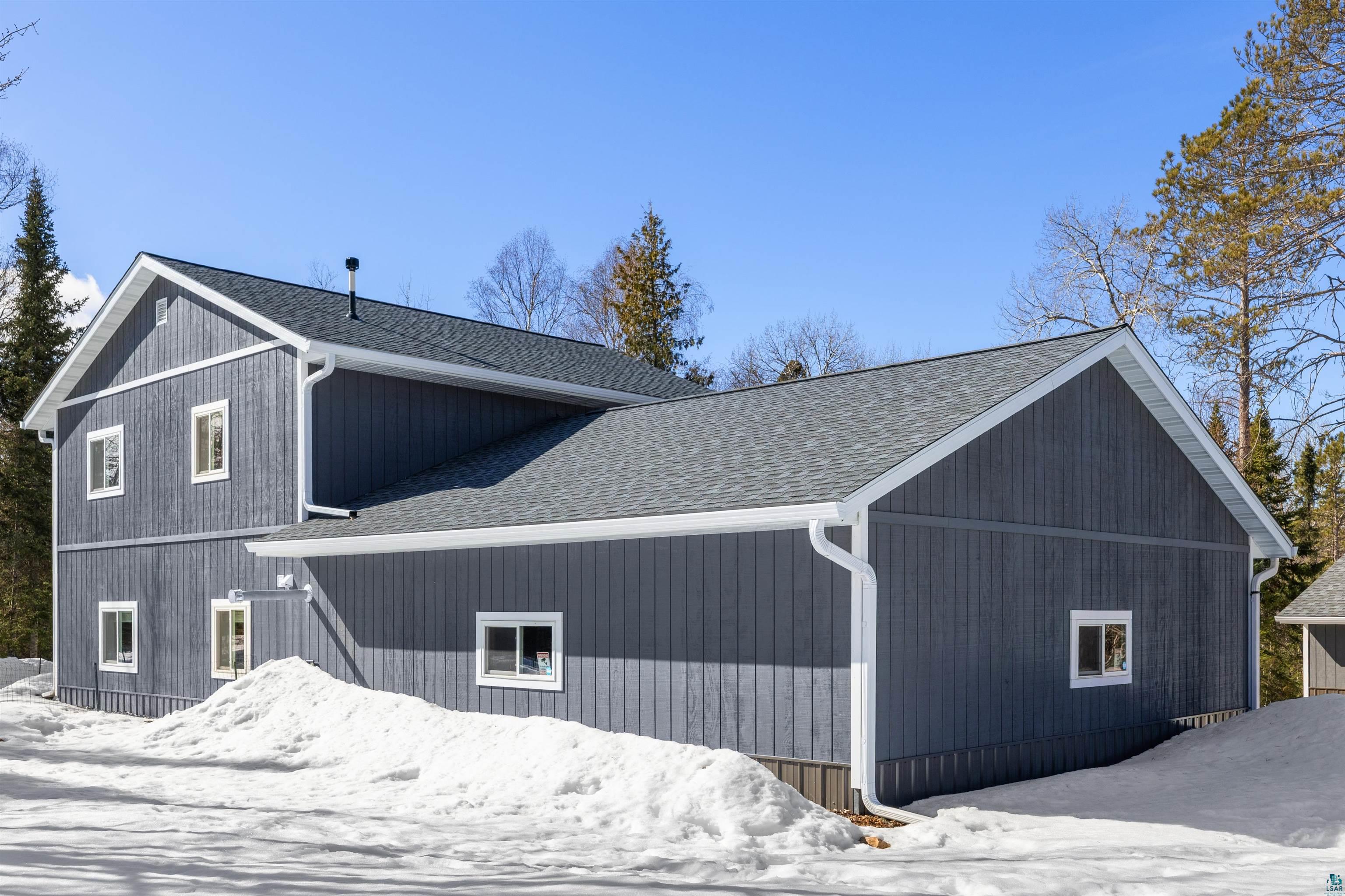 13462 Villa Road Ely, MN 55731 - Photo 28 of 68 Snow covered property featuring roof with shingles