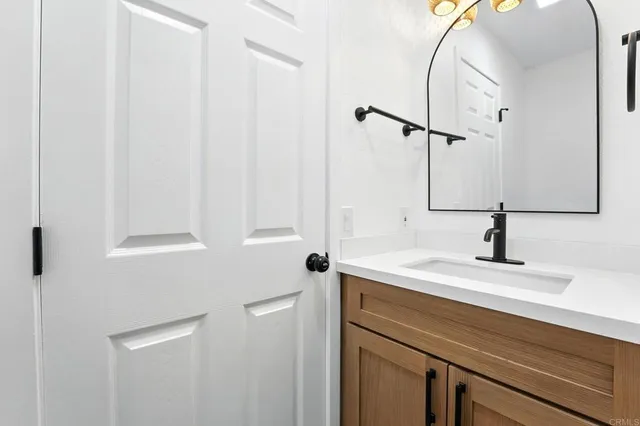 a bathroom with a sink and a mirror