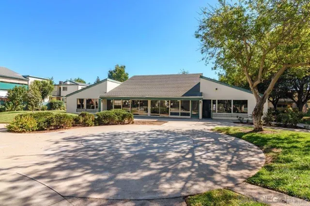 a view of a park that has large trees