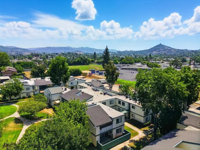 an aerial view of a houses with city view and lake view