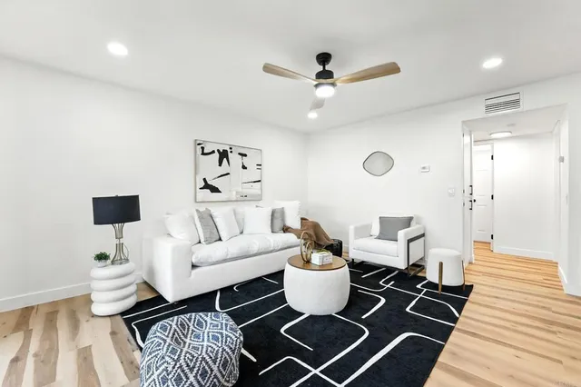 a living room with furniture and a rug