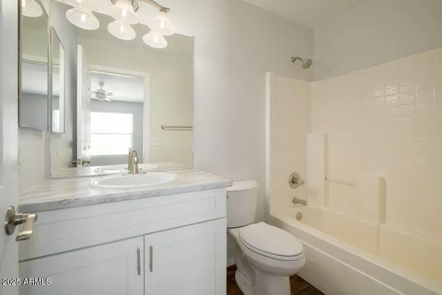 a bathroom with a sink a toilet and a bathtub