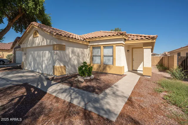 a view of a white house with a outdoor space