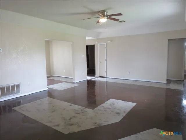 a view of a livingroom with wooden floor