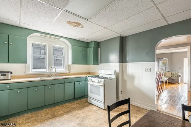 a kitchen with a sink and cabinets