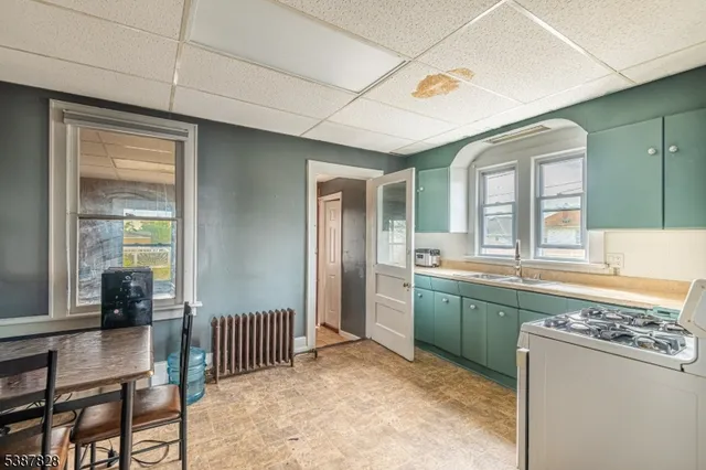 a spacious bathroom with a mirror and a sink