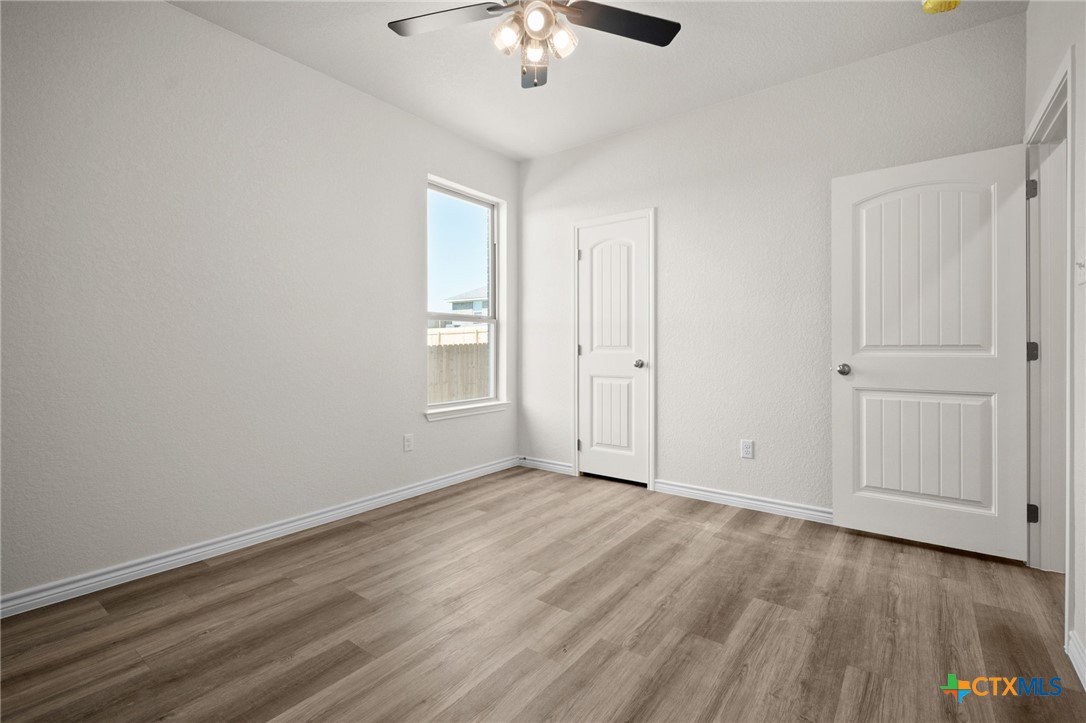 126 Leon Lane Kempner, TX 76539 - Photo 11 of 17 a view of an empty room with wooden floor