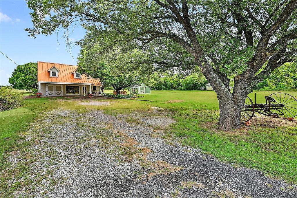 13631 Farm To Market Road 981 Blue Ridge, TX 75424 - Photo 3 of 40 a front view of a house with garden