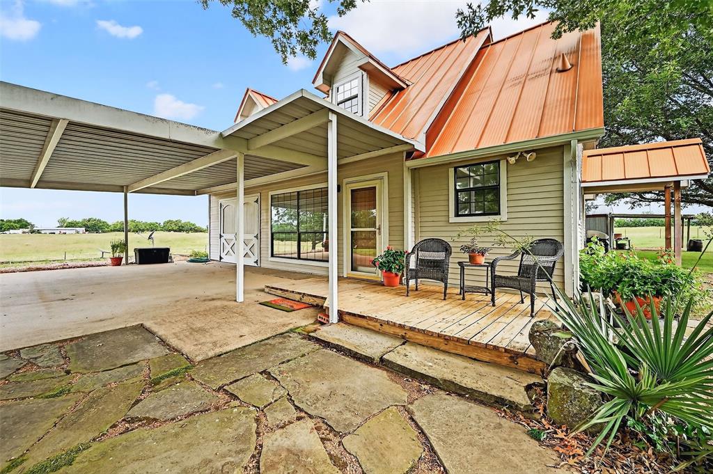 13631 Farm To Market Road 981 Blue Ridge, TX 75424 - Photo 6 of 40 a view of a dinning table and chairs in patio of the house