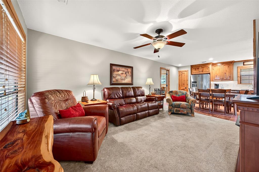 13631 Farm To Market Road 981 Blue Ridge, TX 75424 - Photo 9 of 40 a living room with furniture a large window and a ceiling fan
