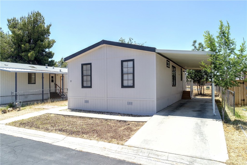 620 West Upjohn Avenue, Unit 33 Ridgecrest, CA 93555 - Photo 1 of 1 a view of a house with a yard