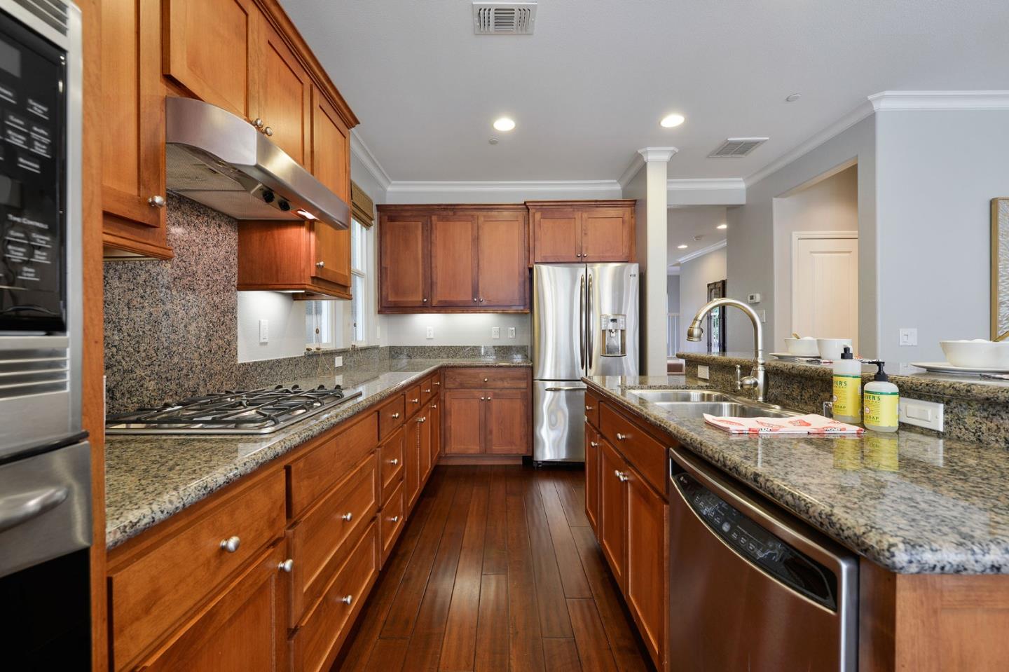 142 Azalea Drive Mountain View, CA 94041 - Photo 12 of 34 a kitchen with stainless steel appliances granite countertop counter space a sink and a stove