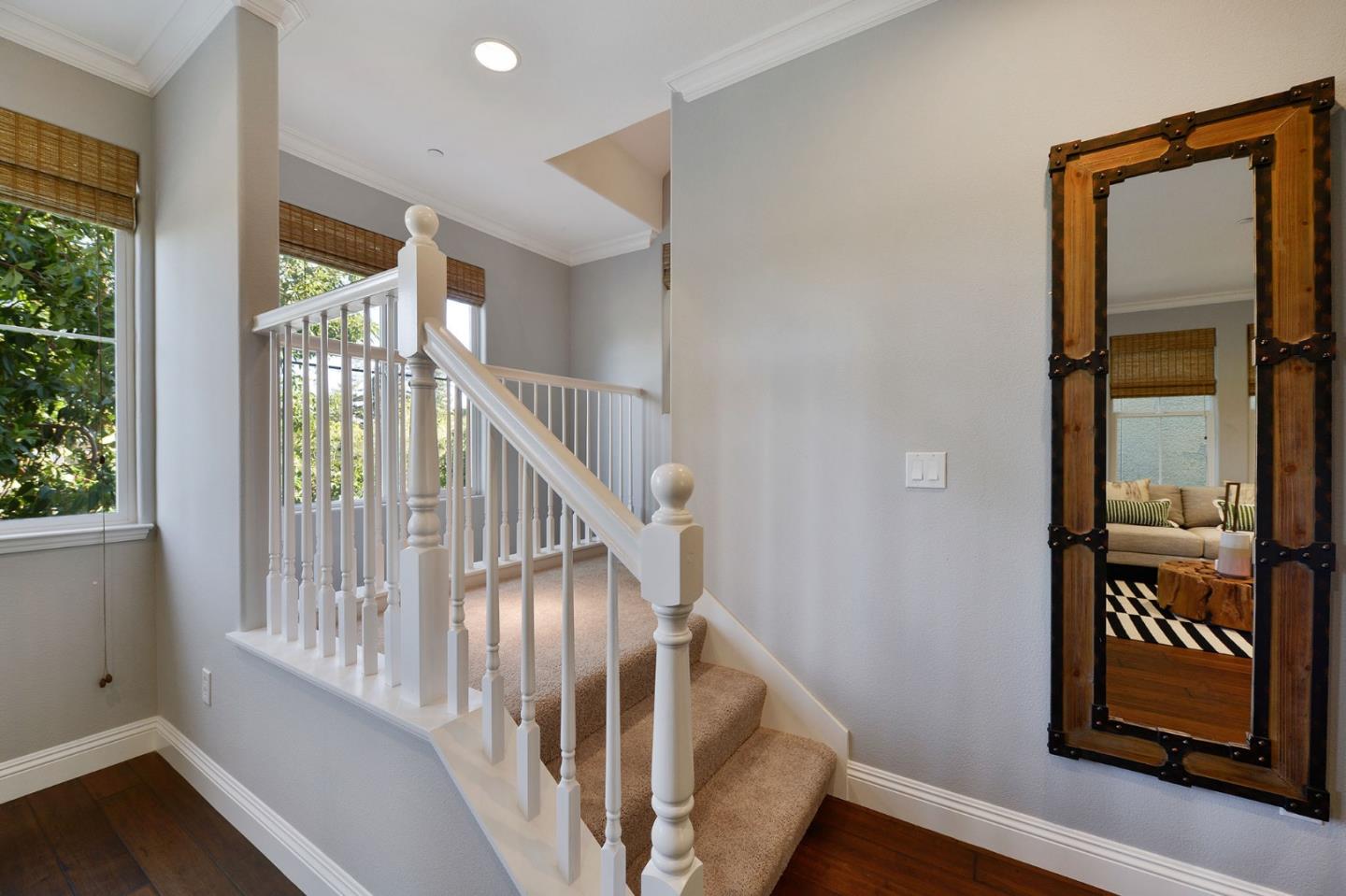 142 Azalea Drive Mountain View, CA 94041 - Photo 15 of 34 a view of staircase with lots of frames on wall and a window
