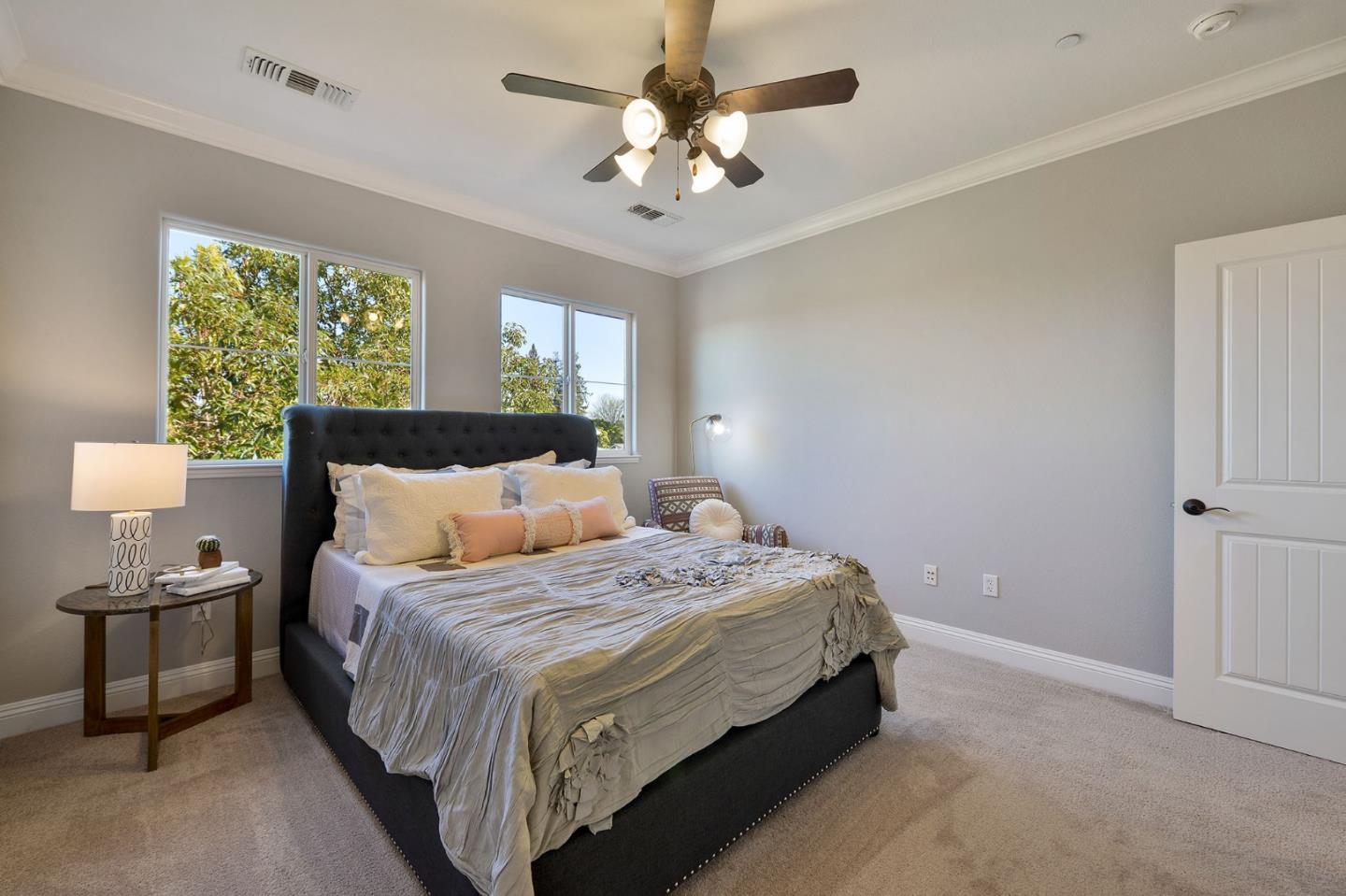 142 Azalea Drive Mountain View, CA 94041 - Photo 16 of 34 a bedroom with a bed and a chandelier