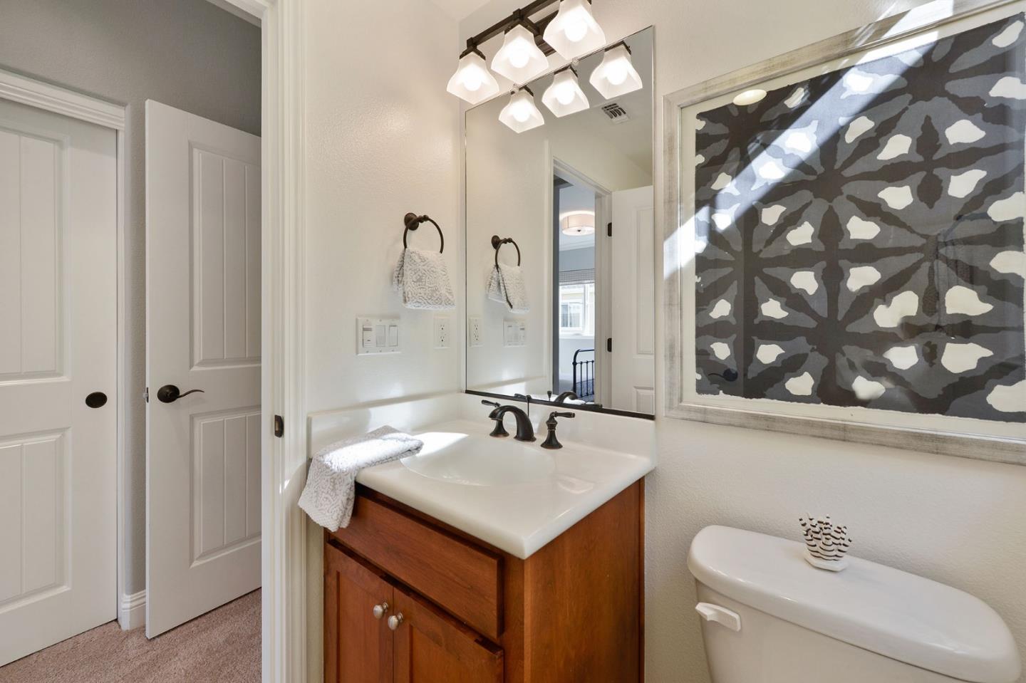 142 Azalea Drive Mountain View, CA 94041 - Photo 23 of 34 a bathroom with a sink and a mirror
