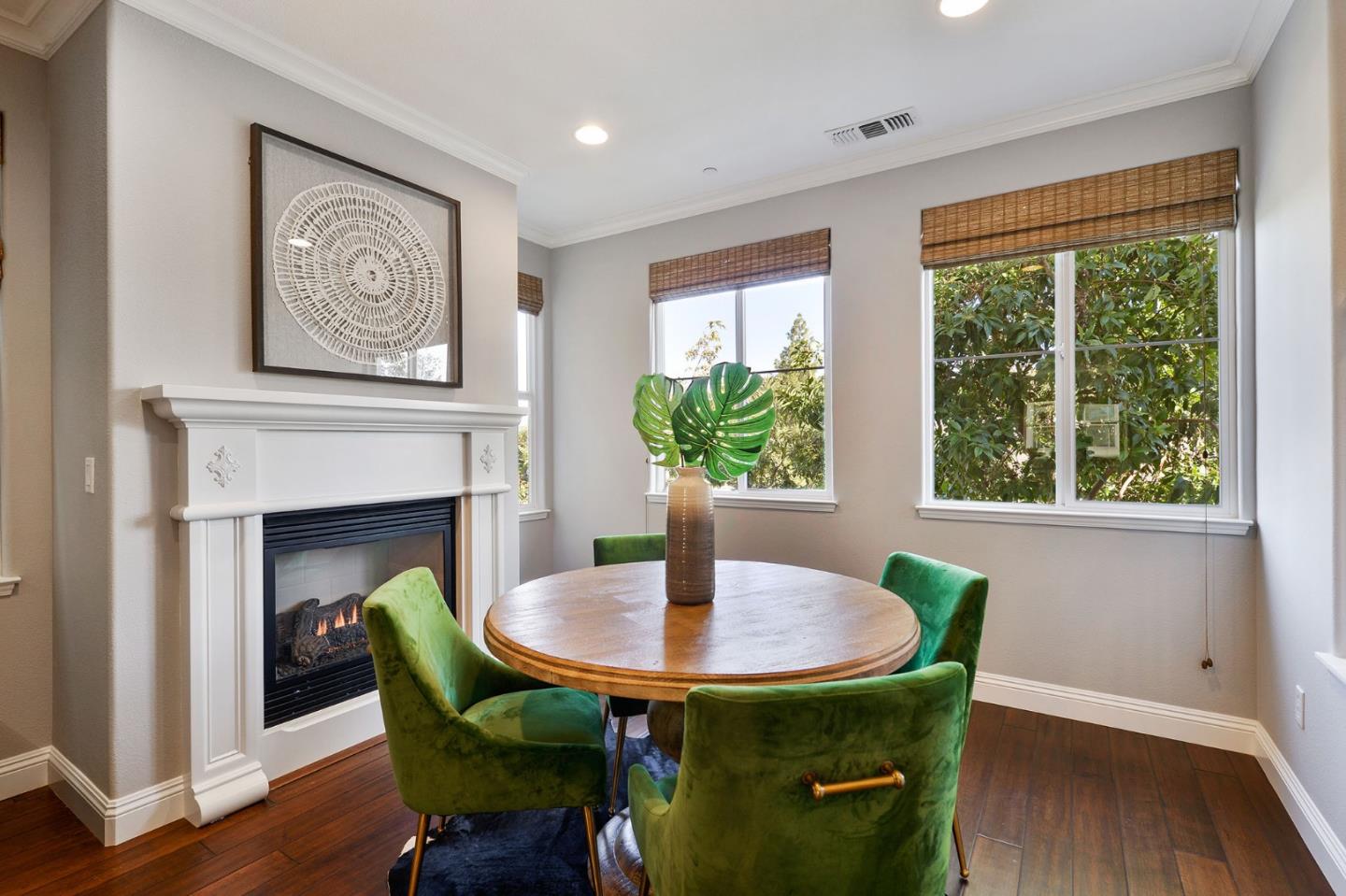 142 Azalea Drive Mountain View, CA 94041 - Photo 5 of 34 a dining room with furniture a fireplace and wooden floor
