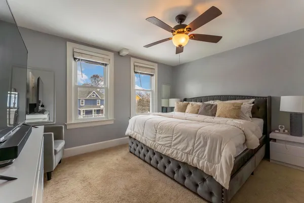 a bedroom with a bed and window
