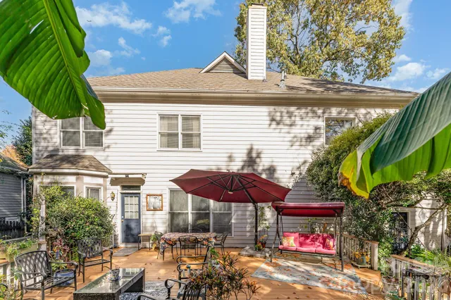 a front view of a building with umbrellas