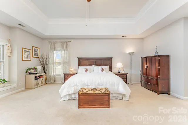 a bedroom with a bed and cabinets