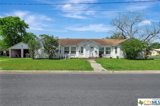 a view of house with outdoor space and street view