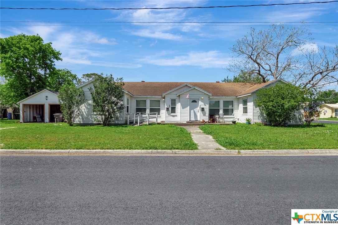 a view of house with outdoor space and street view