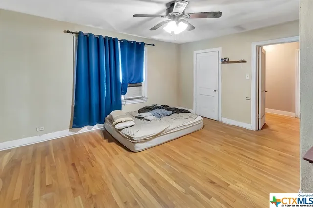 a view of a livingroom with wooden floor and closet area