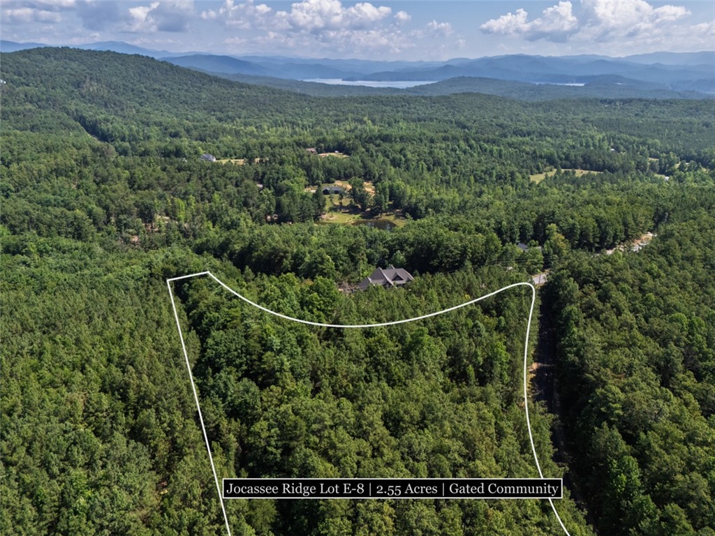 231 Jocassee Ridge Way Salem, SC 29676 - Photo 5 of 15 A sprawling forested lot offers seclusion and distant lake vistas within a gated community.